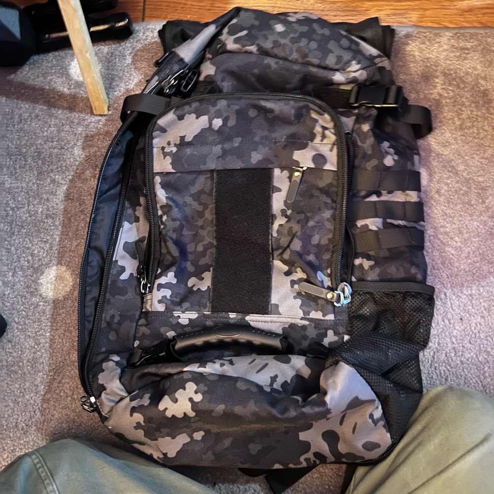 Camo backpack. Convert to shoulder bag. NO strap. Has multiple pockets
